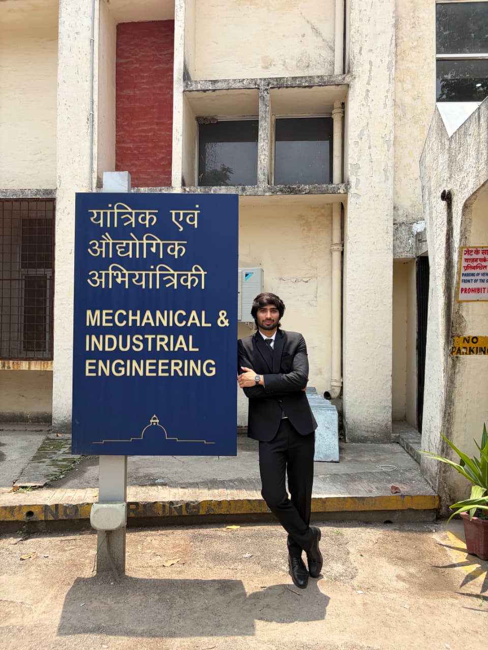 Lokesh Kumar standing beside the Mechanical & Industrial Engineering department sign at IIT Roorkee